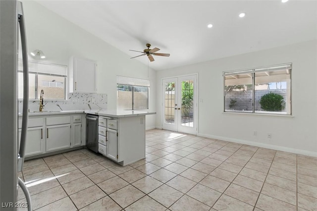 9116 Cypress Point Way, Las Vegas, NV 89117 - kitchen featuring a peninsula, vaulted ceiling, french doors, ceiling fan, and a sink