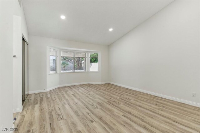 9116 Cypress Point Way, Las Vegas, NV 89117 - empty room featuring light wood-type flooring, recessed lighting, baseboards, and lofted ceiling