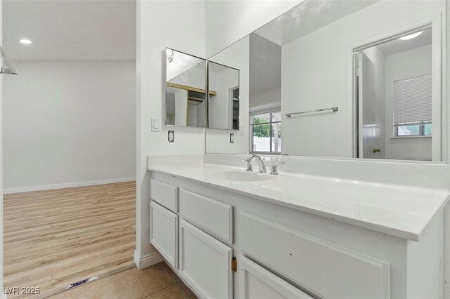 9116 Cypress Point Way, Las Vegas, NV 89117 - bathroom with vanity, baseboards, and tile patterned floors