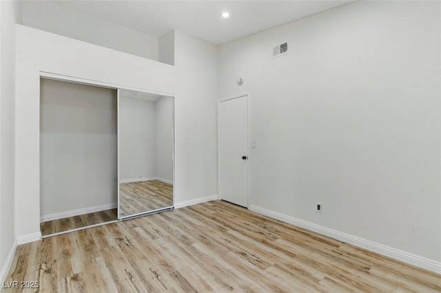 9116 Cypress Point Way, Las Vegas, NV 89117 - unfurnished bedroom featuring wood finished floors, a closet, baseboards, and recessed lighting