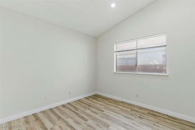 9116 Cypress Point Way, Las Vegas, NV 89117 - spare room featuring vaulted ceiling, light wood-style floors, baseboards, and recessed lighting