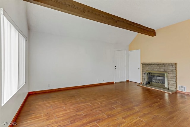 4391 Gannet Cir Unit 16, Las Vegas, NV 89103 - unfurnished living room with wood finished floors, baseboards, and a brick fireplace