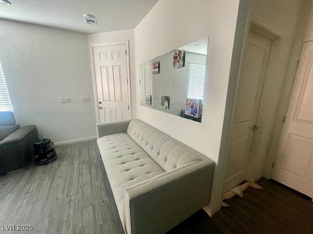 3447 SW Covilha Ln, Henderson, NV 89044 - hallway featuring wood finished floors and plenty of natural light