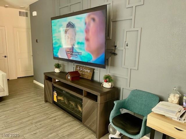 3447 SW Covilha Ln, Henderson, NV 89044 - interior space with light wood finished floors and baseboards