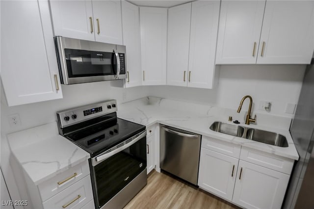 2711 Sesame Dr, Las Vegas, NV 89142 - kitchen featuring stainless steel appliances, a sink, and white cabinets