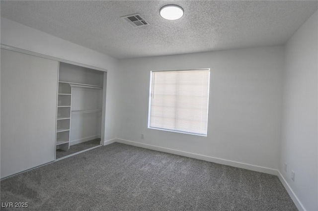 2711 Sesame Dr, Las Vegas, NV 89142 - unfurnished bedroom with carpet floors, a textured ceiling, a closet, and baseboards