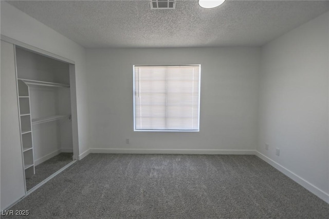 2711 Sesame Dr, Las Vegas, NV 89142 - unfurnished bedroom with carpet, a textured ceiling, a closet, and baseboards