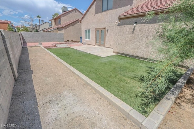 2711 Sesame Dr, Las Vegas, NV 89142 - view of yard with french doors and a patio area