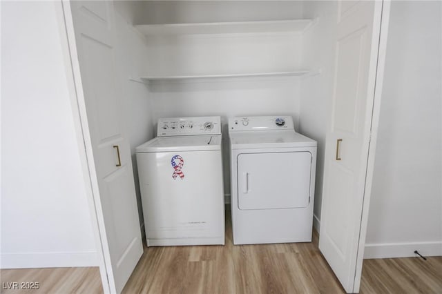 2711 Sesame Dr, Las Vegas, NV 89142 - laundry area featuring washer and dryer, light wood-style floors, and baseboards