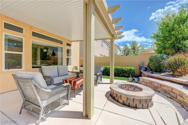 9729 Hawk Crest St, Las Vegas, NV 89141 - view of patio featuring an outdoor living space with a fire pit