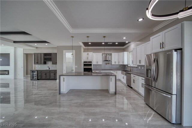 2650 Underbrush Ave, Pahrump, NV 89048 - kitchen featuring appliances with stainless steel finishes, ornamental molding, wine cooler, dark countertops, and decorative backsplash
