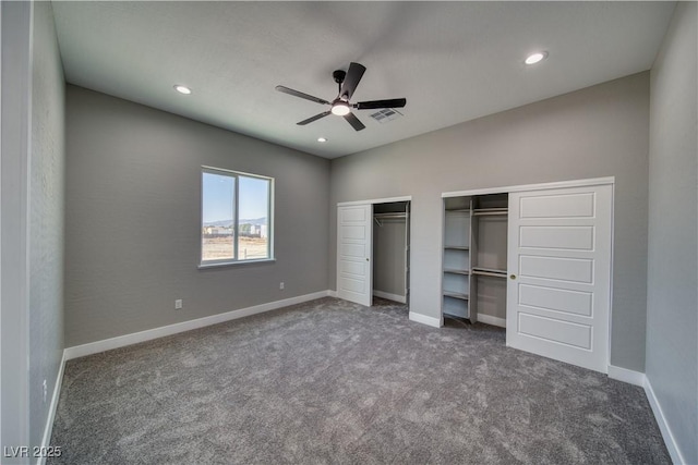 2650 Underbrush Ave, Pahrump, NV 89048 - unfurnished bedroom with multiple closets, carpet floors, recessed lighting, and a ceiling fan