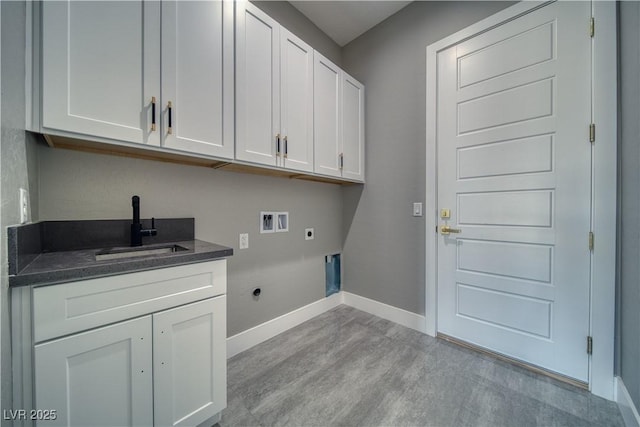 2650 Underbrush Ave, Pahrump, NV 89048 - laundry room featuring electric dryer hookup, hookup for a washing machine, cabinet space, and light wood-style floors
