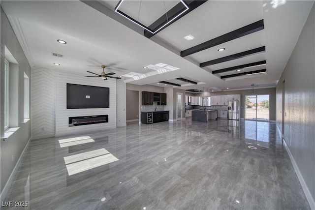 2650 Underbrush Ave, Pahrump, NV 89048 - unfurnished living room with a ceiling fan and a large fireplace