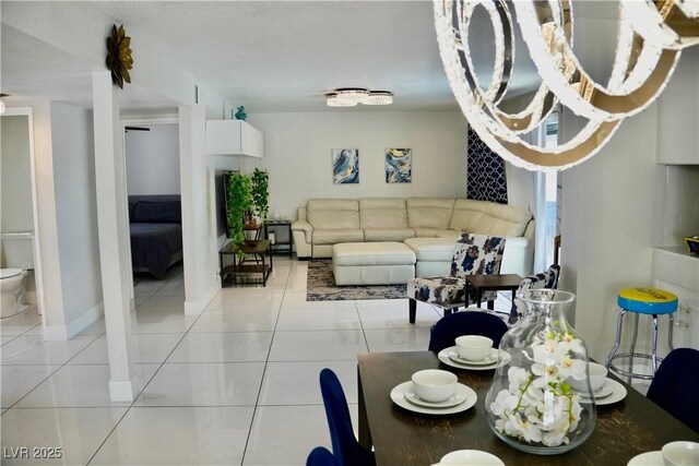 2659 Vegas Valley Dr, Las Vegas, NV 89121 - dining space with light tile patterned floors and baseboards