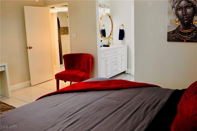 2659 Vegas Valley Dr, Las Vegas, NV 89121 - bedroom featuring a sink, light tile patterned flooring, ensuite bathroom, and baseboards