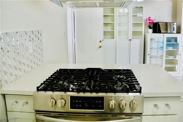 2659 Vegas Valley Dr, Las Vegas, NV 89121 - kitchen featuring stainless steel gas stove and tasteful backsplash