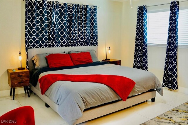 2659 Vegas Valley Dr, Las Vegas, NV 89121 - bedroom with tile patterned floors and baseboards