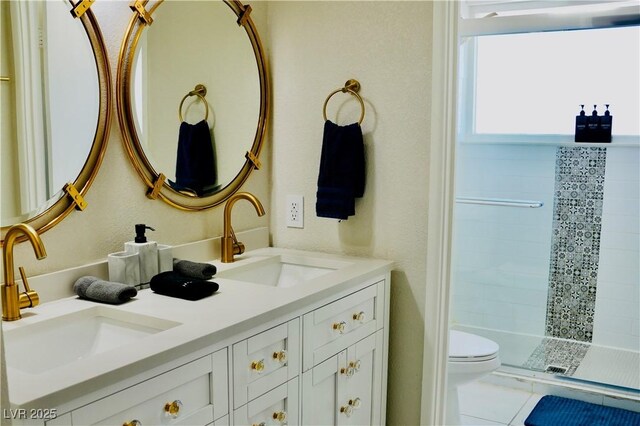 2659 Vegas Valley Dr, Las Vegas, NV 89121 - full bath featuring double vanity, toilet, tiled shower, and tile patterned flooring