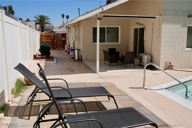 2659 Vegas Valley Dr, Las Vegas, NV 89121 - back of property with ac unit, a fenced backyard, a patio area, and stucco siding