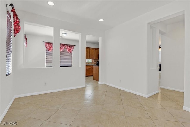 3689 Bufflehead St, Las Vegas, NV 89122 - spare room with light tile patterned floors, baseboards, and recessed lighting