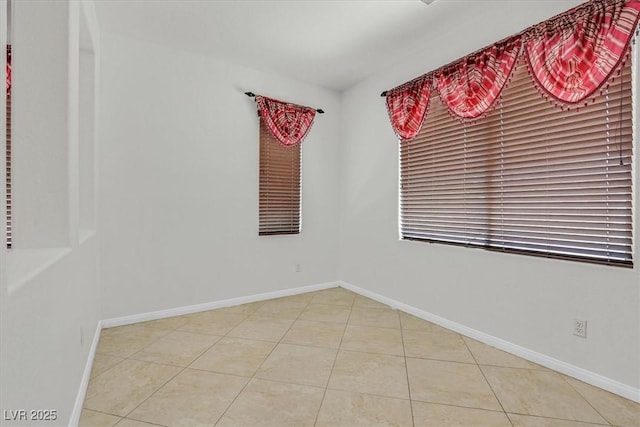 3689 Bufflehead St, Las Vegas, NV 89122 - tiled spare room featuring baseboards