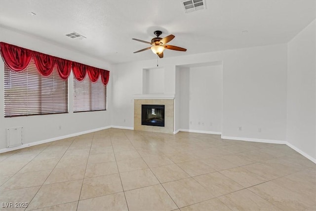 3689 Bufflehead St, Las Vegas, NV 89122 - unfurnished living room featuring a ceiling fan, baseboards, a tile fireplace, and light tile patterned floors