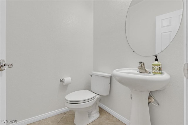 3689 Bufflehead St, Las Vegas, NV 89122 - half bathroom featuring tile patterned flooring, toilet, and baseboards