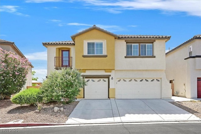 3689 Bufflehead St, Las Vegas, NV 89122 - mediterranean / spanish-style house with a garage, stucco siding, and a tile roof