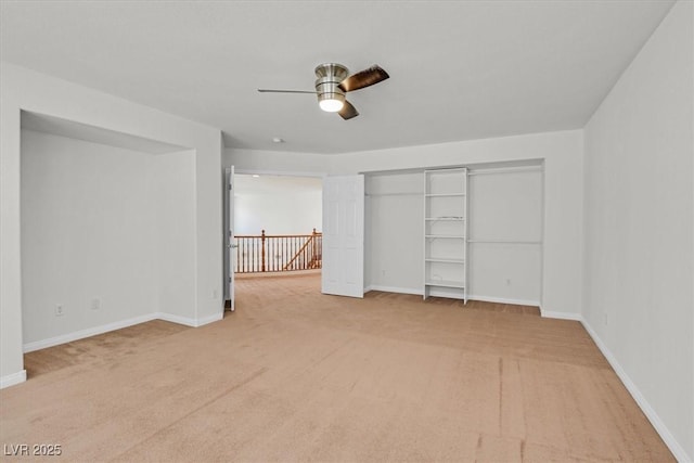 3689 Bufflehead St, Las Vegas, NV 89122 - unfurnished bedroom with light carpet, baseboards, a ceiling fan, and a closet