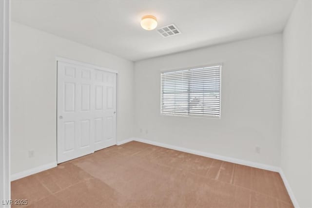 3689 Bufflehead St, Las Vegas, NV 89122 - unfurnished bedroom with carpet floors, baseboards, and a closet