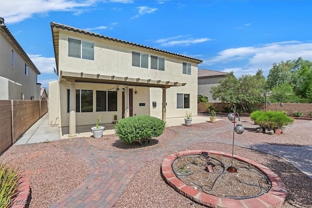 3689 Bufflehead St, Las Vegas, NV 89122 - rear view of house with a patio area, stucco siding, a fenced backyard, and a ceiling fan