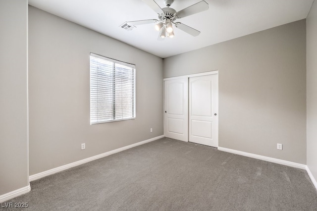 3725 Moonshine Falls Ave, North Las Vegas, NV 89085 - unfurnished bedroom with carpet, baseboards, a closet, and a ceiling fan