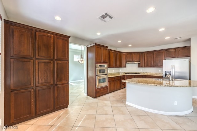 3725 Moonshine Falls Ave, North Las Vegas, NV 89085 - kitchen featuring stainless steel appliances, recessed lighting, a sink, light stone countertops, and light tile patterned flooring