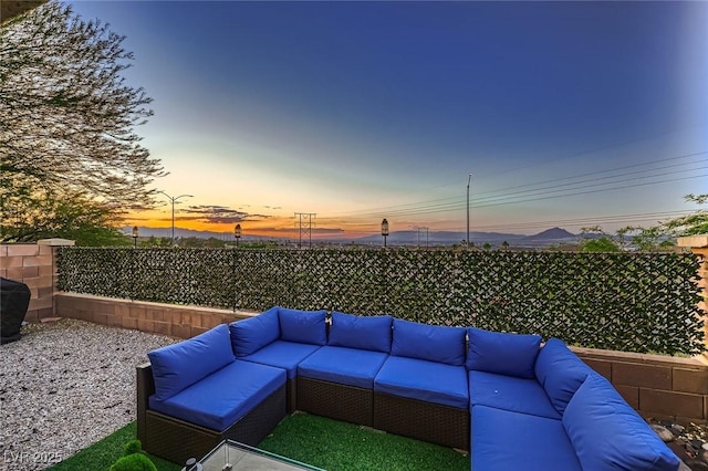 672 Solitude Point Ave, Henderson, NV 89012 - fenced backyard with an outdoor hangout area