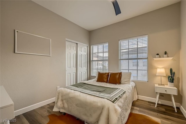 672 Solitude Point Ave, Henderson, NV 89012 - bedroom with a closet, baseboards, wood finished floors, and a ceiling fan