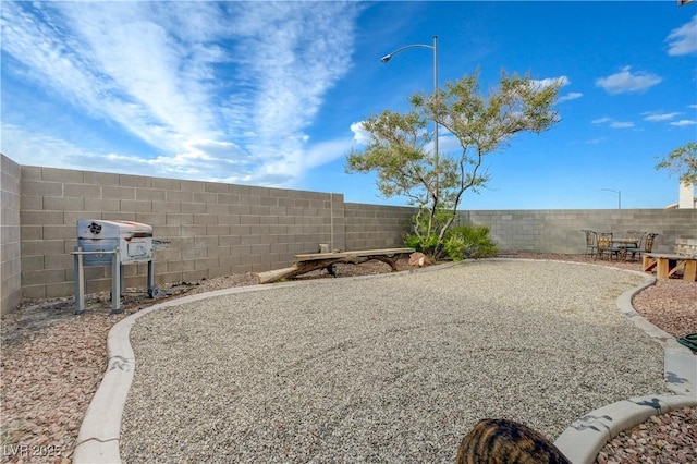 7528 Golden Yucca Dr, Las Vegas, NV 89147 - fenced backyard featuring a patio