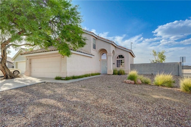 7528 Golden Yucca Dr, Las Vegas, NV 89147 - mediterranean / spanish-style home with an attached garage, stucco siding, and concrete driveway