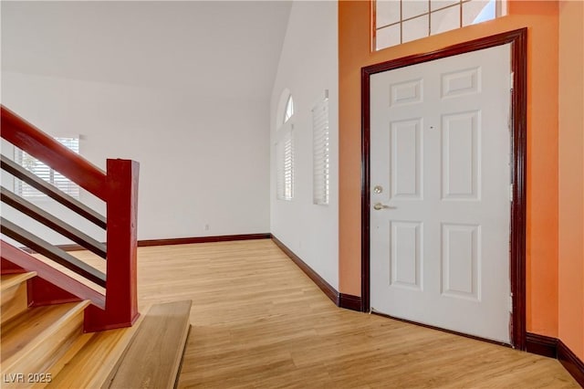 7528 Golden Yucca Dr, Las Vegas, NV 89147 - entryway with wood finished floors, stairway, a towering ceiling, and plenty of natural light