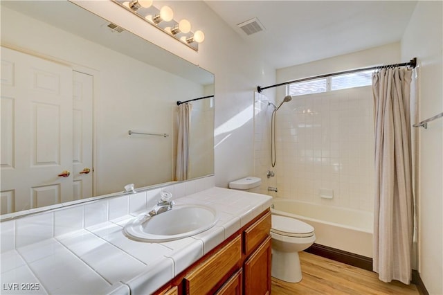 7528 Golden Yucca Dr, Las Vegas, NV 89147 - bathroom with vanity, shower / tub combo with curtain, and wood finished floors