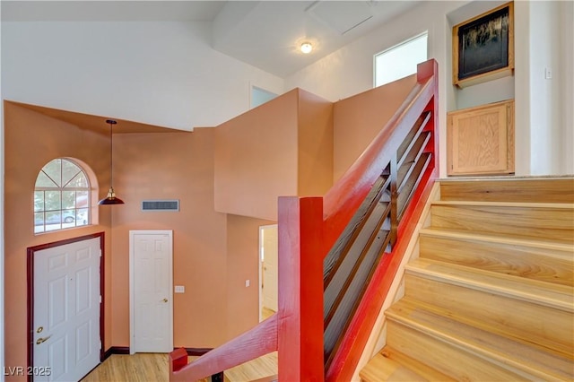 7528 Golden Yucca Dr, Las Vegas, NV 89147 - foyer entrance featuring a towering ceiling, light wood finished floors, and stairway