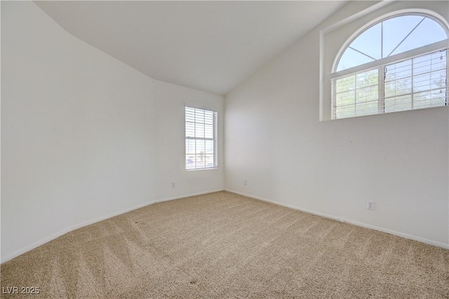 7528 Golden Yucca Dr, Las Vegas, NV 89147 - empty room featuring carpet floors, healthy amount of natural light, and lofted ceiling