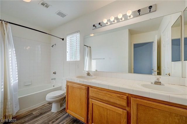 7528 Golden Yucca Dr, Las Vegas, NV 89147 - full bath with shower / tub combo with curtain, double vanity, and wood finished floors