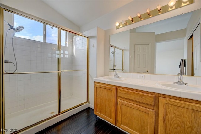 7528 Golden Yucca Dr, Las Vegas, NV 89147 - full bathroom featuring a stall shower, wood finished floors, and double vanity