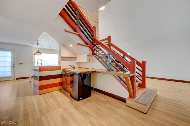 7528 Golden Yucca Dr, Las Vegas, NV 89147 - stairs with wood finished floors and recessed lighting