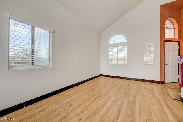 7528 Golden Yucca Dr, Las Vegas, NV 89147 - unfurnished room featuring high vaulted ceiling and wood finished floors