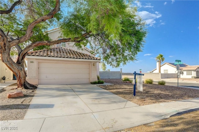 7528 Golden Yucca Dr, Las Vegas, NV 89147 - mediterranean / spanish house with a tile roof, driveway, and stucco siding