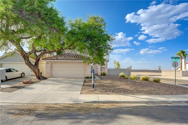 7528 Golden Yucca Dr, Las Vegas, NV 89147 - view of front facade with driveway, a tile roof, and stucco siding