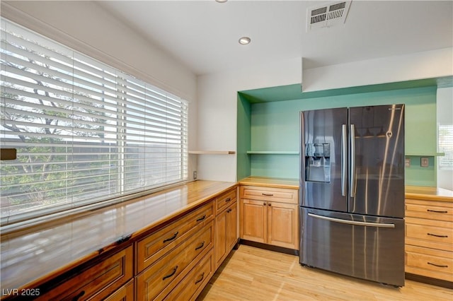 7528 Golden Yucca Dr, Las Vegas, NV 89147 - kitchen with stainless steel fridge with ice dispenser, light countertops, open shelves, light wood-style flooring, and recessed lighting