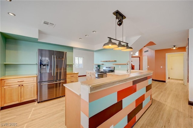 7528 Golden Yucca Dr, Las Vegas, NV 89147 - kitchen with appliances with stainless steel finishes, light wood finished floors, light countertops, recessed lighting, and pendant lighting